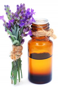 Bottle with lavender oil isolated on white background